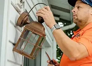 RRG tech installing an exterior light